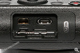 AV OUT / DIGITAL 以及 HDMI 插口。旁边 Wi-Fi 标志表明 GM1 具备内置 Wi-Fi。
